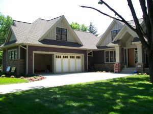 Moderninbeige-300x225 The image shows the exterior of a custom-built craftsman home