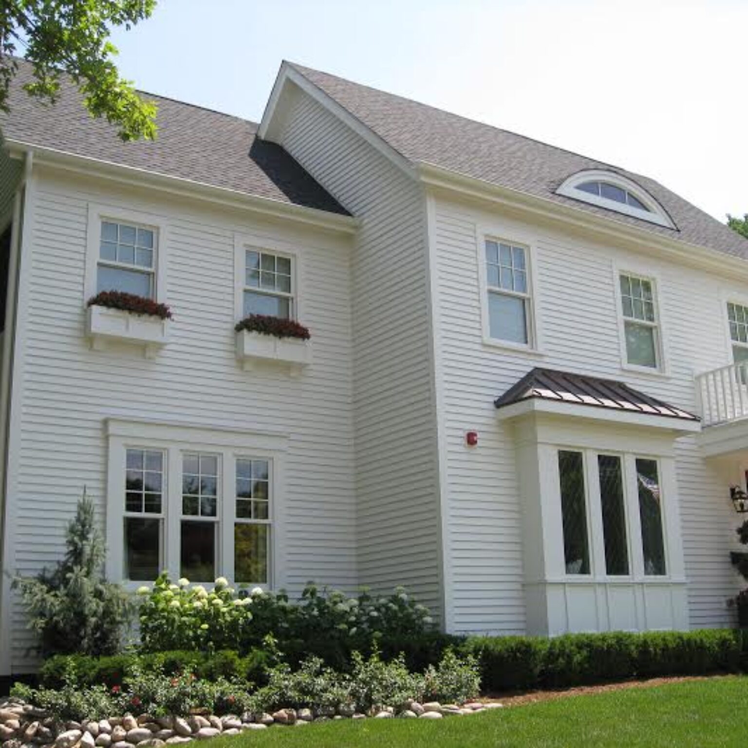 white home with roofing